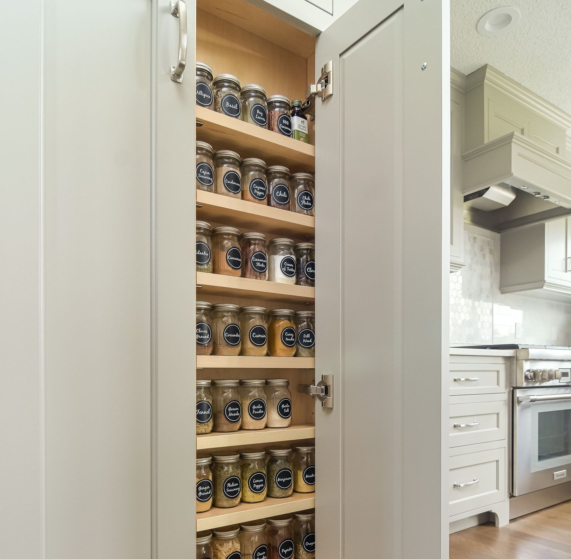 kitchen pantry neatly organized with matching glass jars