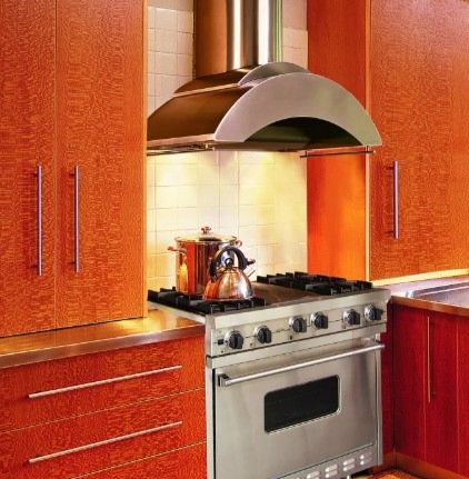 custom kitchen with stainless steel range hood