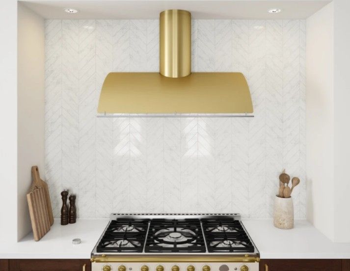 custom kitchen with gold range hood