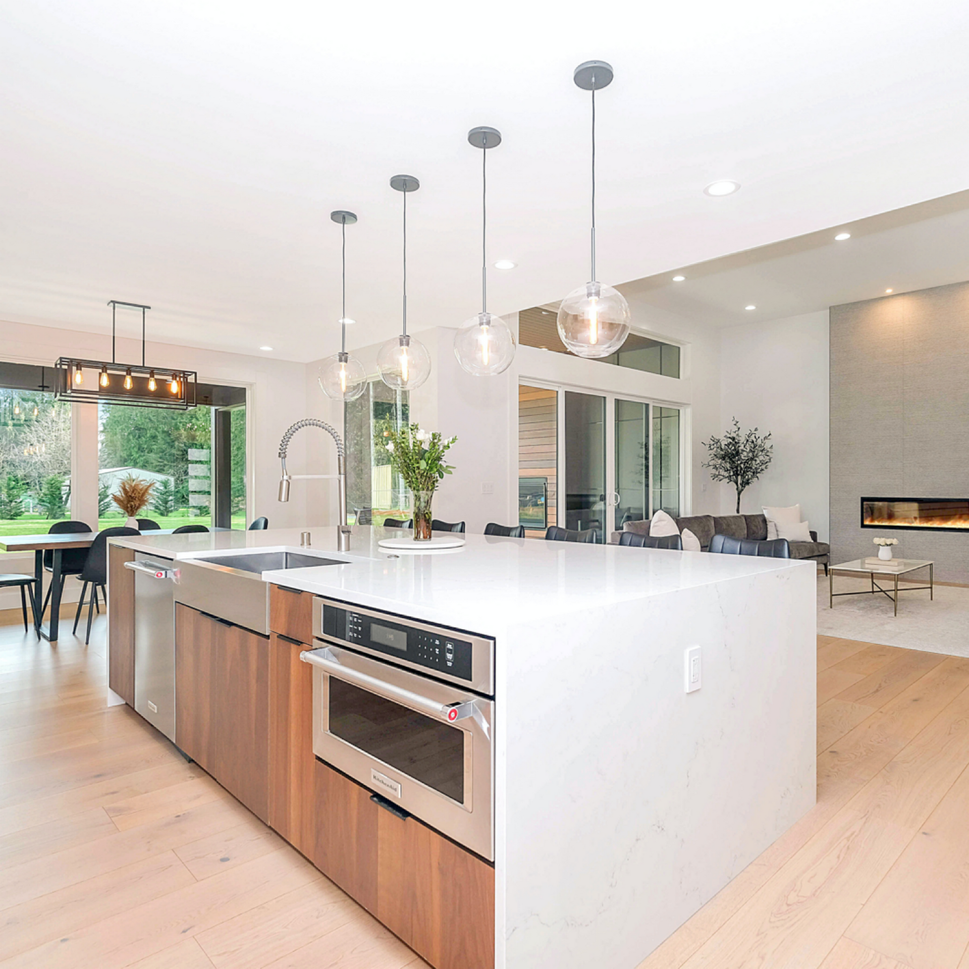 open custom kitchen space with white counter top and outlets