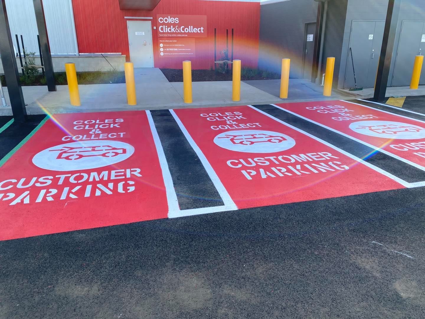 A red and white parking lot with the words customer parking written on it