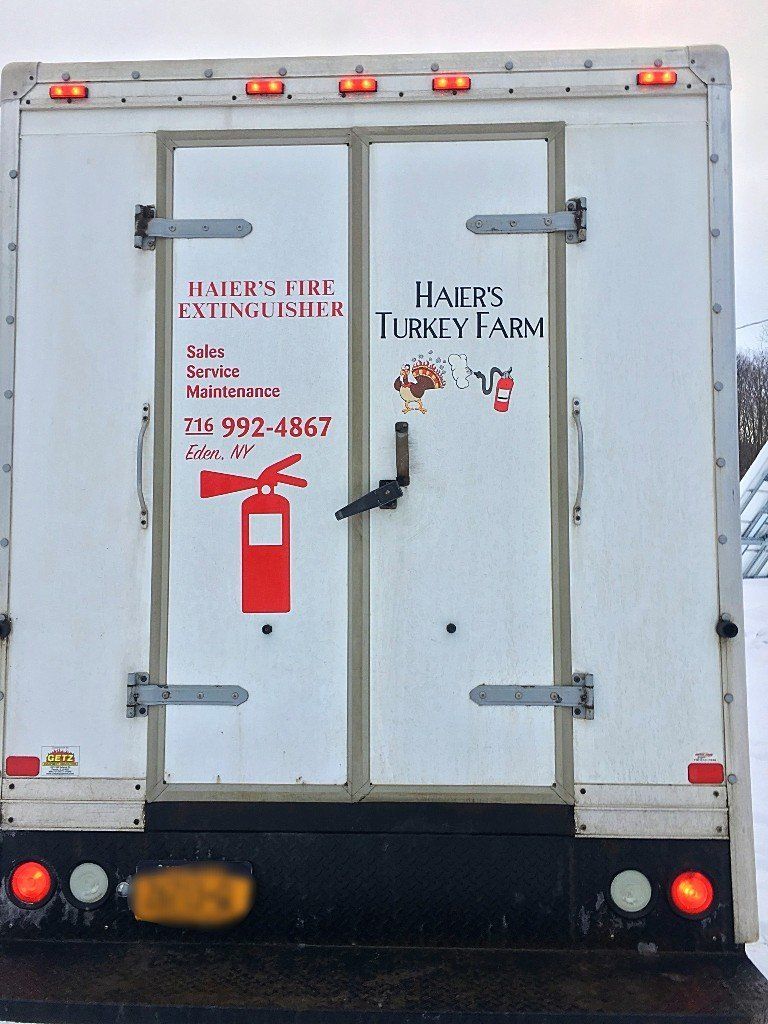The back of a white turkey farm truck