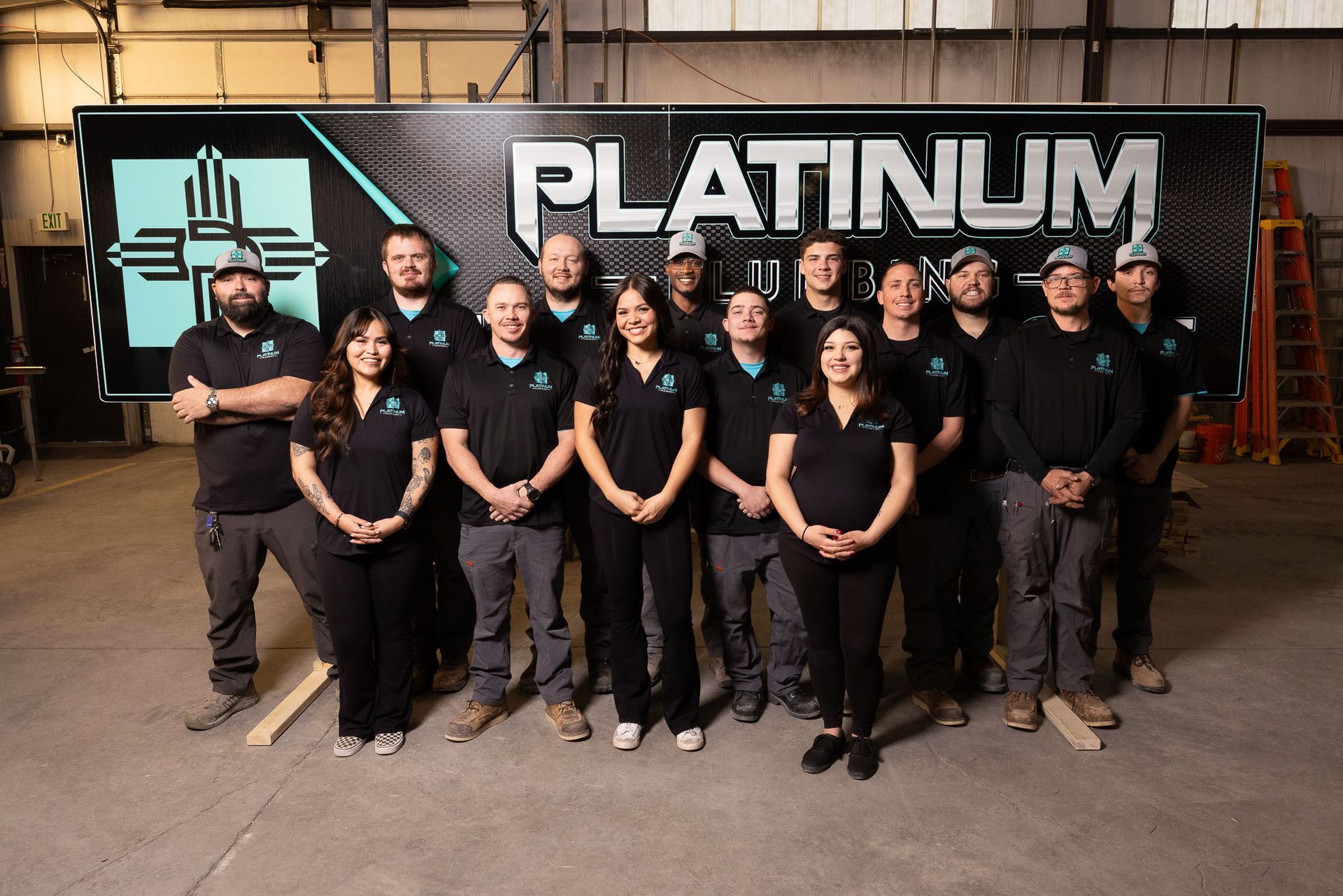 Platinum Plumbing Team are posing for a picture together.