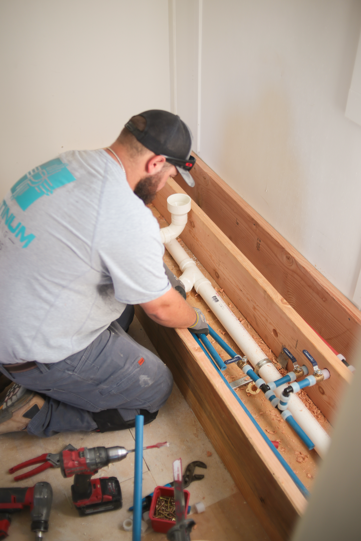 A yellow ladder is next to a water heater