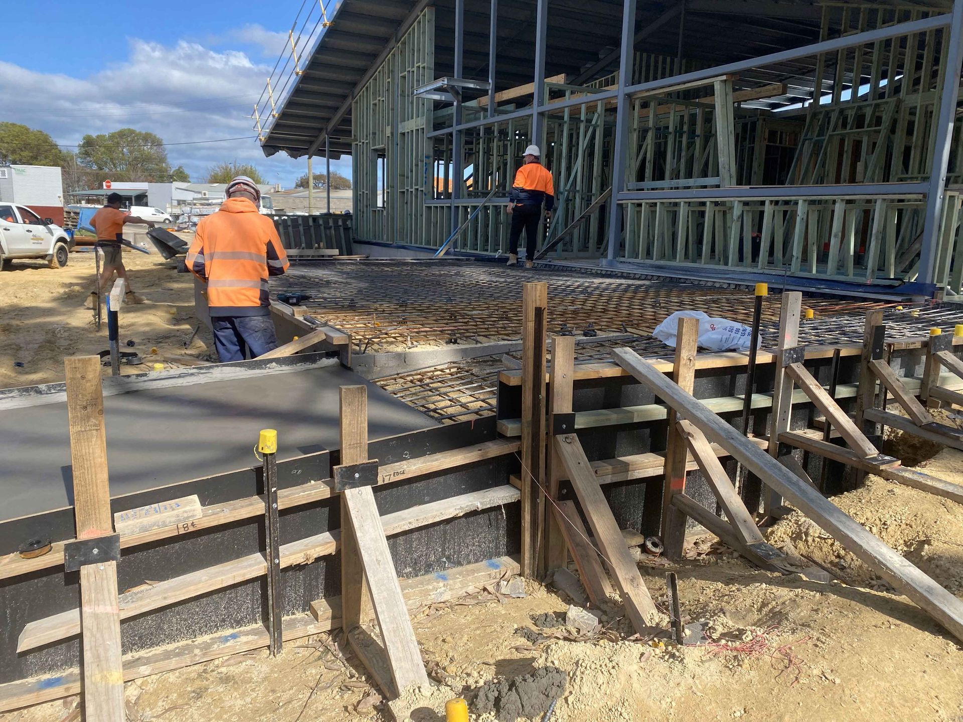 A group of construction workers are working on a construction site.