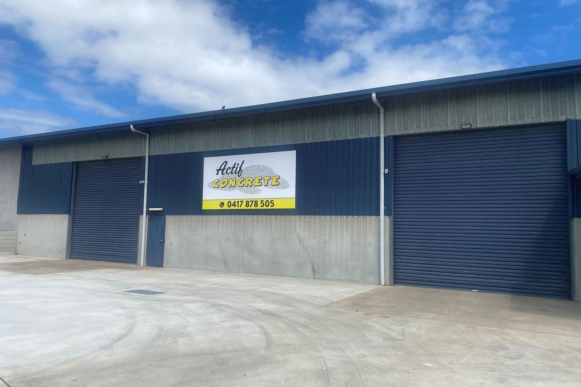 A large building with a sign on the side of it.