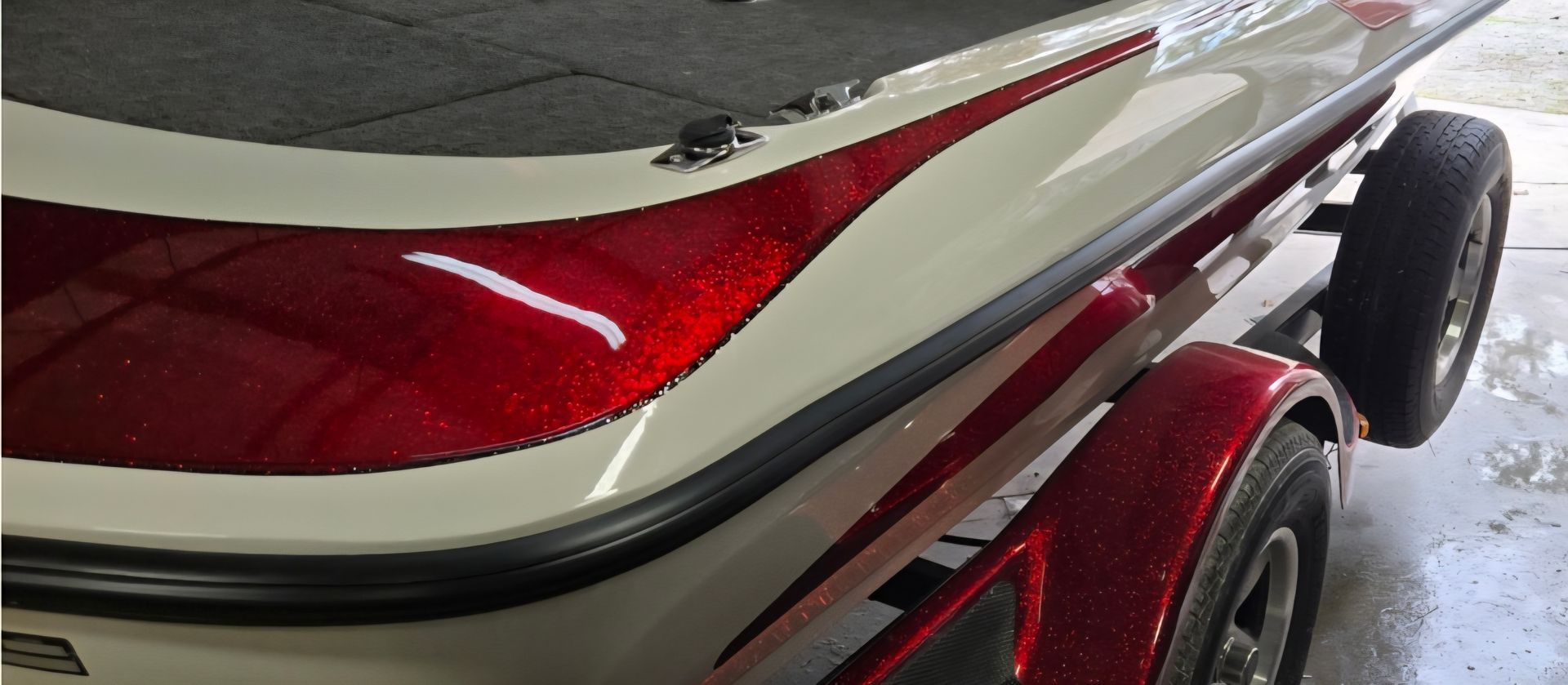 Burned-out homes and debris from a fire, with a truck and mountain in the background.