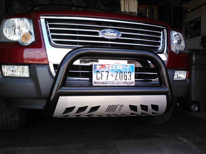 A red ford with a texas license plate
