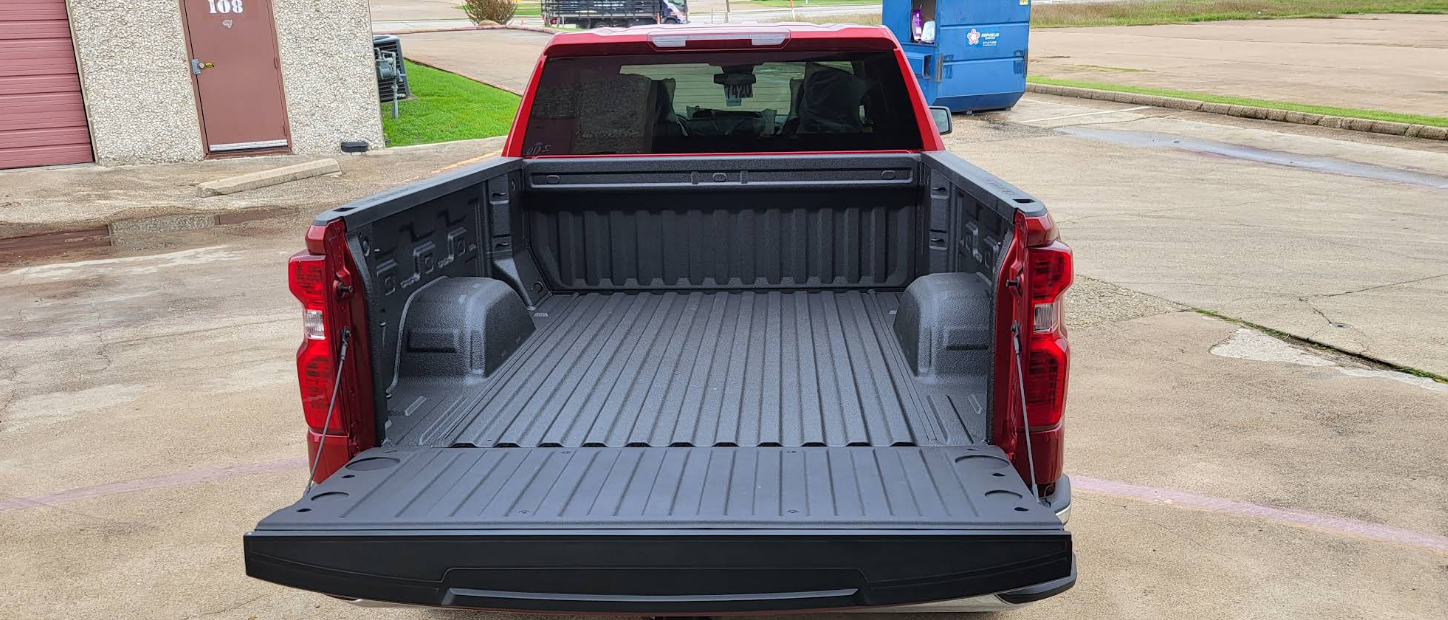 A person is cleaning a suitcase with a towel.
