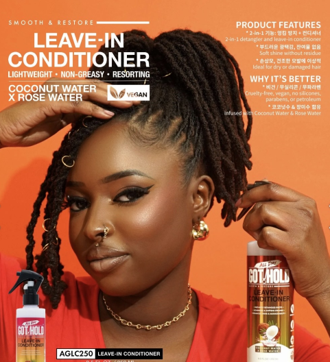 A woman is holding a pair of scissors and a wig.