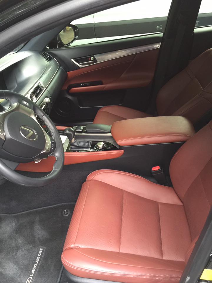 The interior of a lexus car with red leather seats