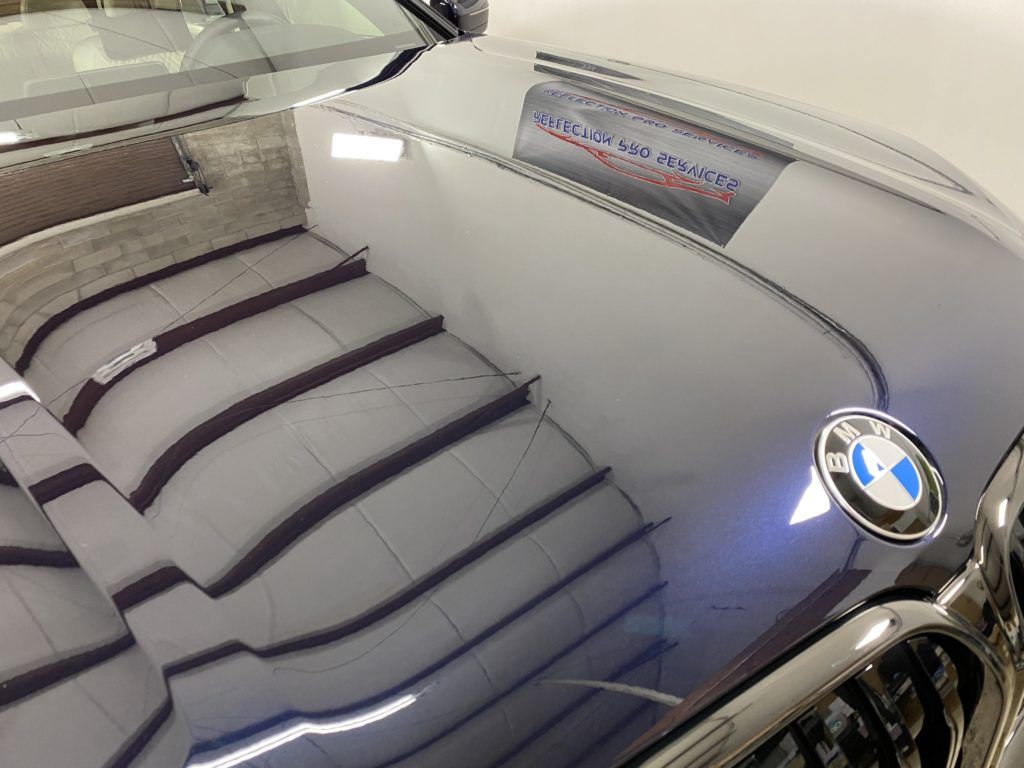 A close up of the hood of a bmw car