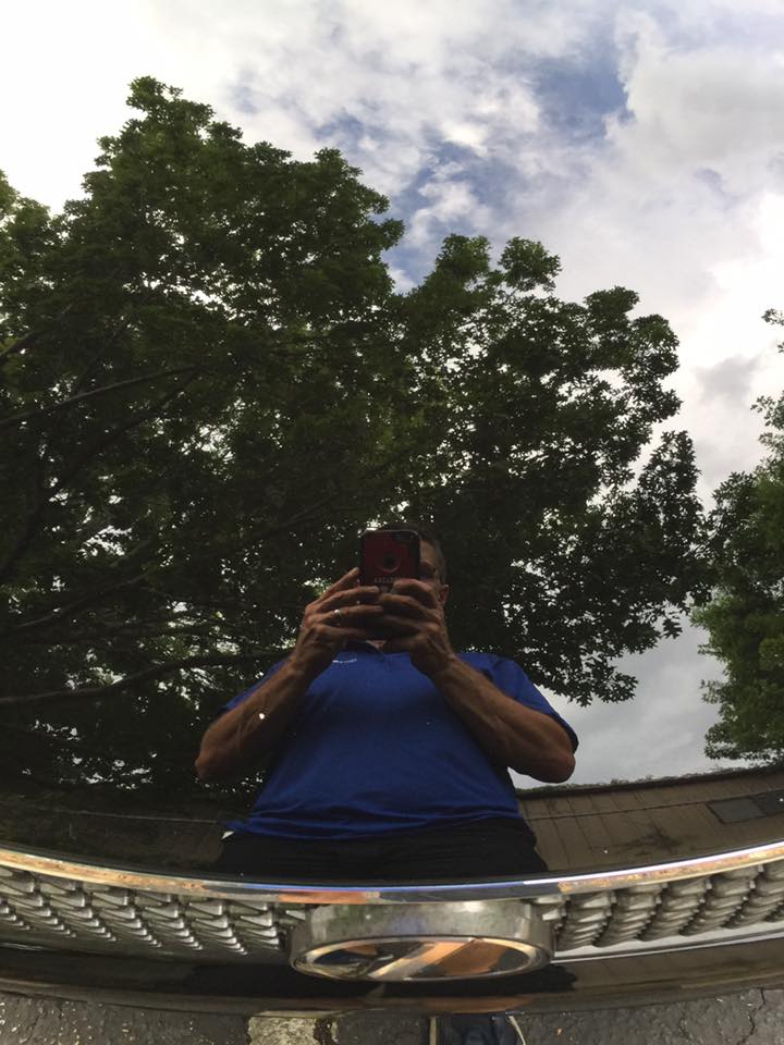 A man taking a picture of himself in a mirror