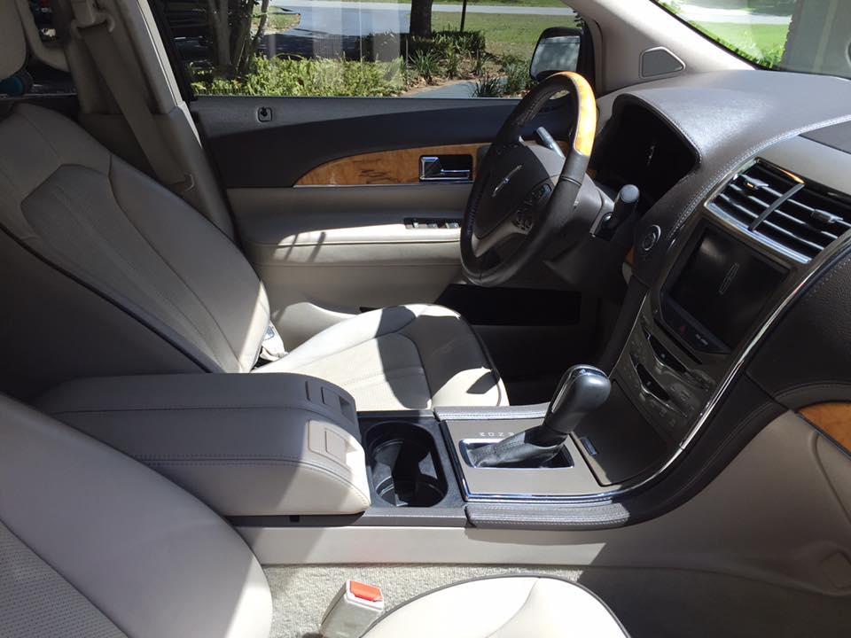 The interior of a car with a steering wheel