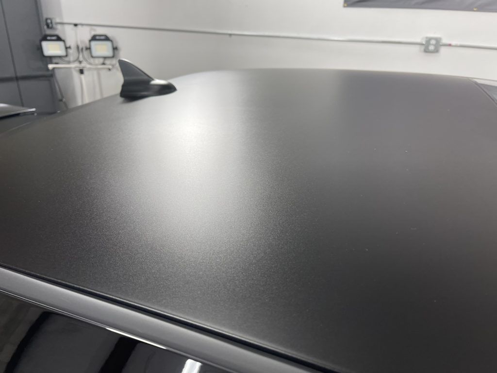 A close up of the roof of a black car