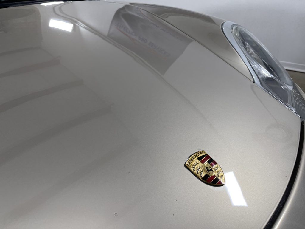 A close up of the hood of a porsche 911 turbo s.