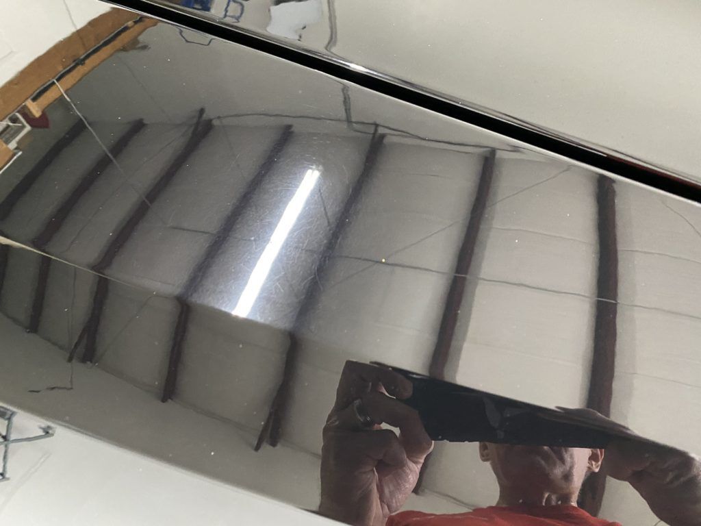 A man is taking a picture of himself in a mirror