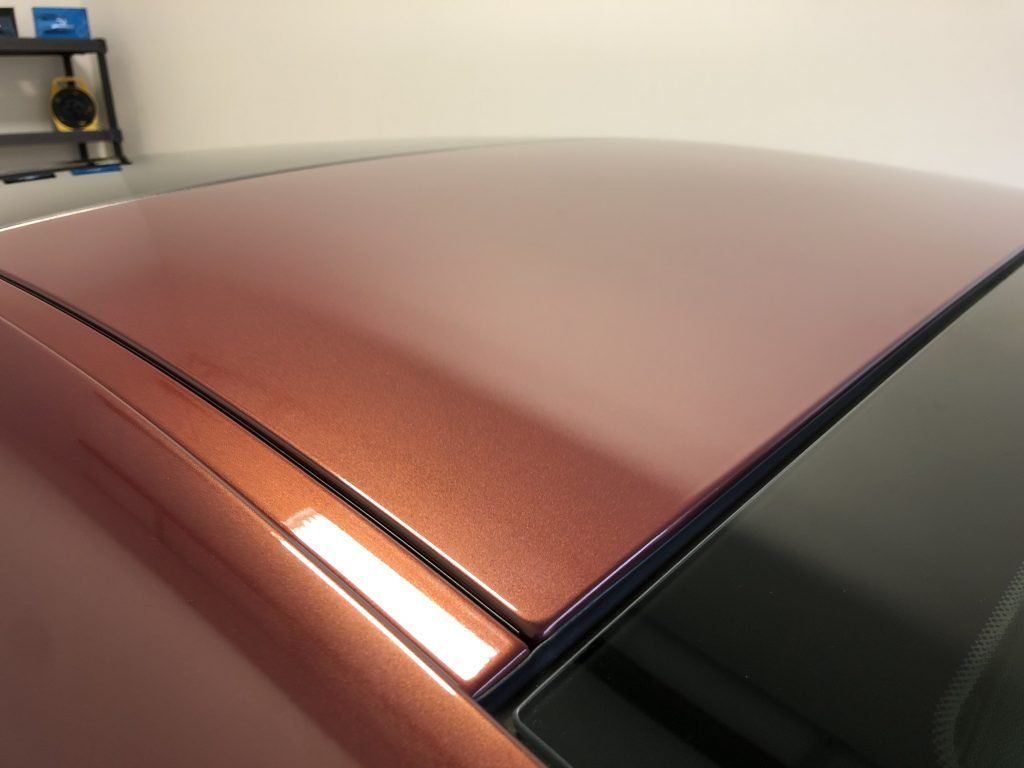 A close up of the roof of a red car