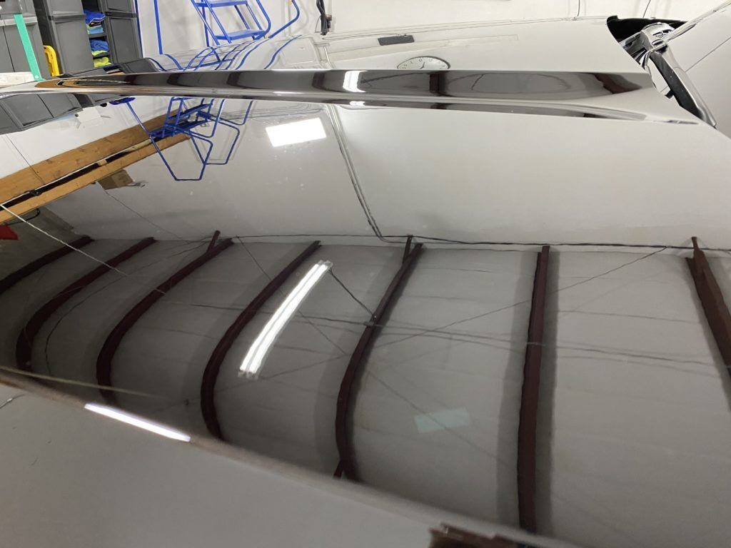 A ceiling with a reflection of a building in it.