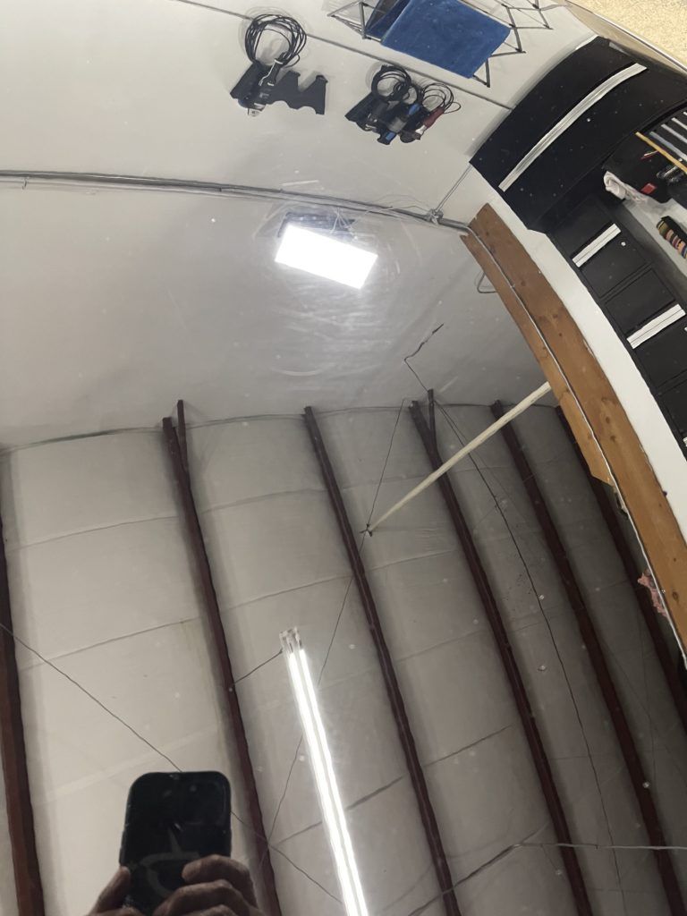 A person is taking a picture of themselves in a mirror