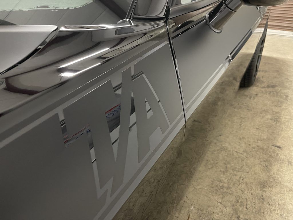 A close up of the side of a car with the word wa on it