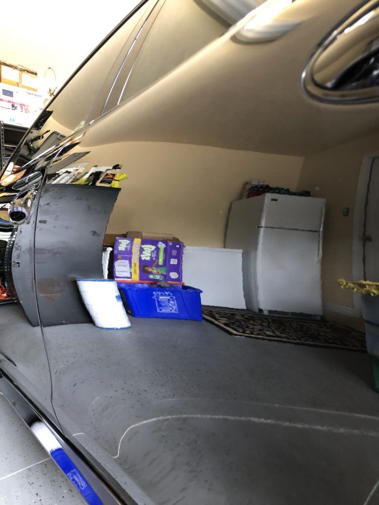 A van is filled with boxes and a refrigerator.