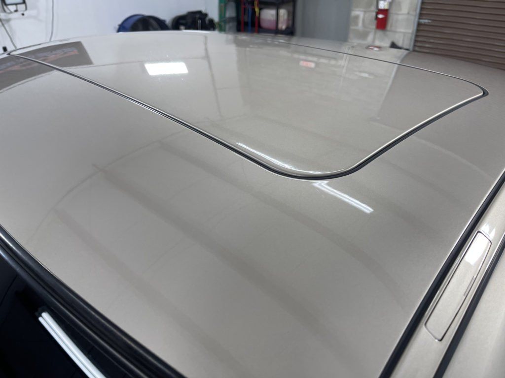 A close up of the roof of a car in a garage.