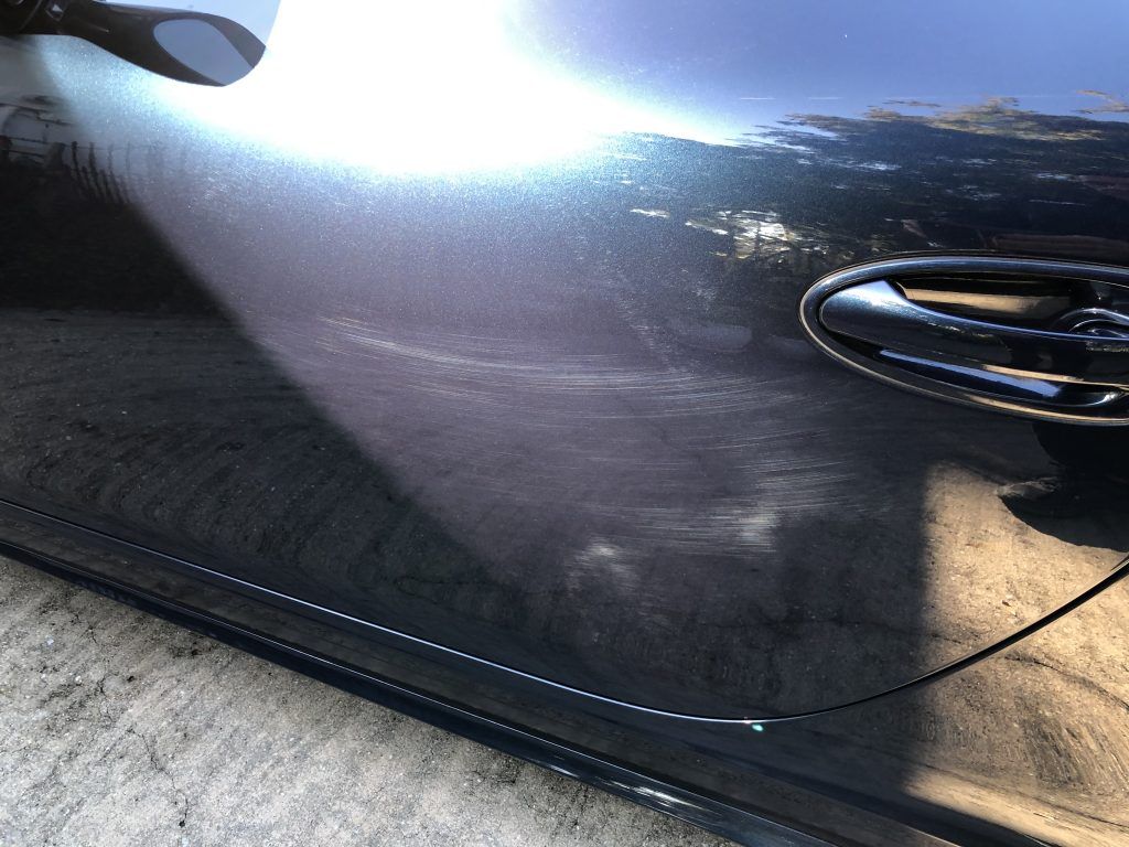 A close up of the door handle of a car