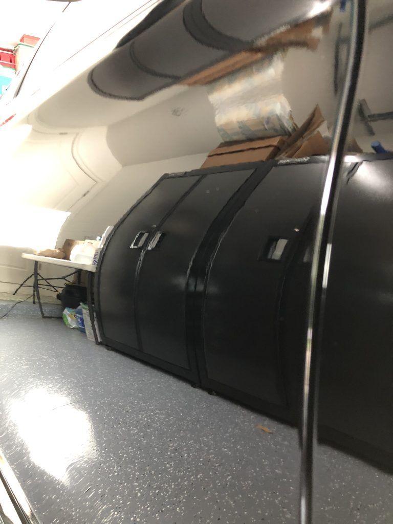 A close up of a black door on a boat