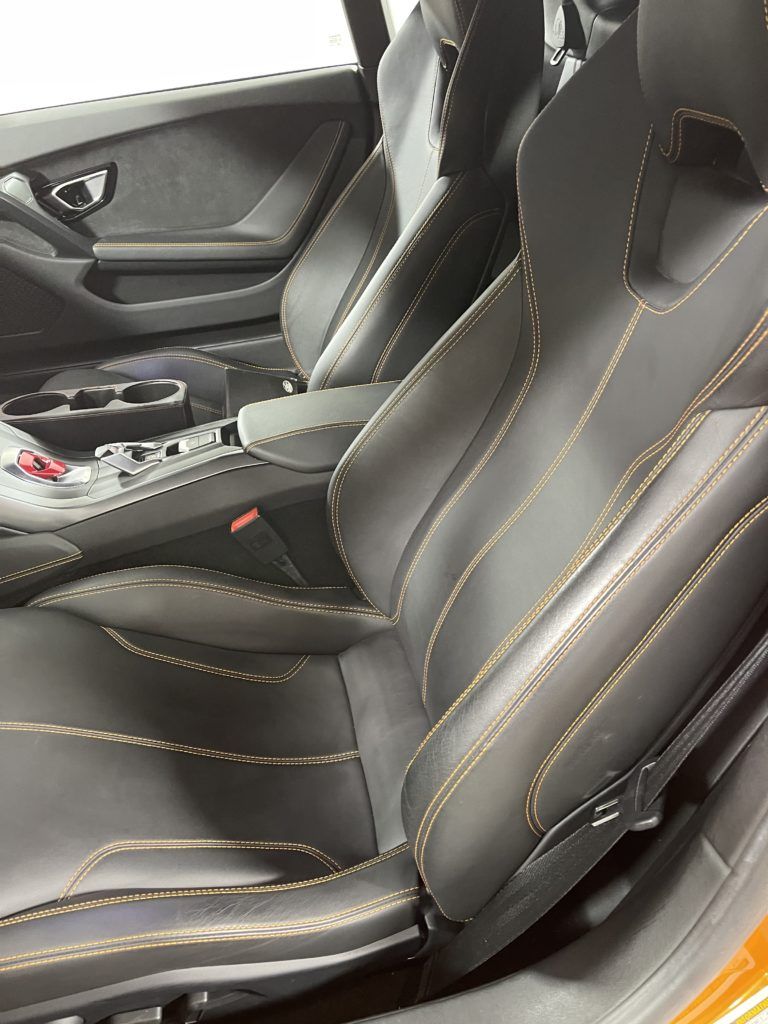 A close up of the seats in a lamborghini huracan.