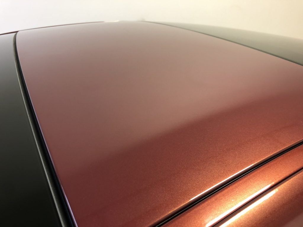 A close up of the roof of a red car
