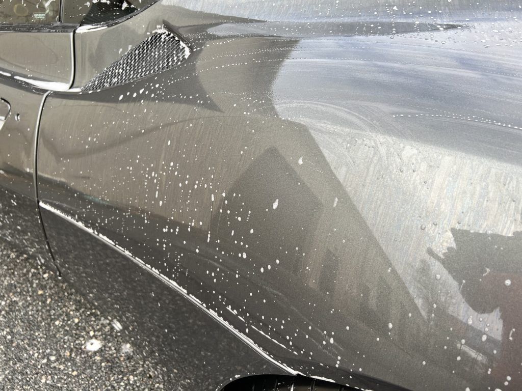 A close up of a car with a lot of dust on it