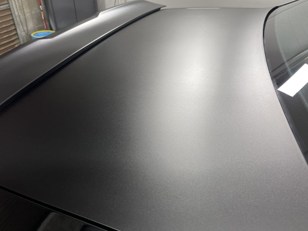 A close up of the roof of a black car