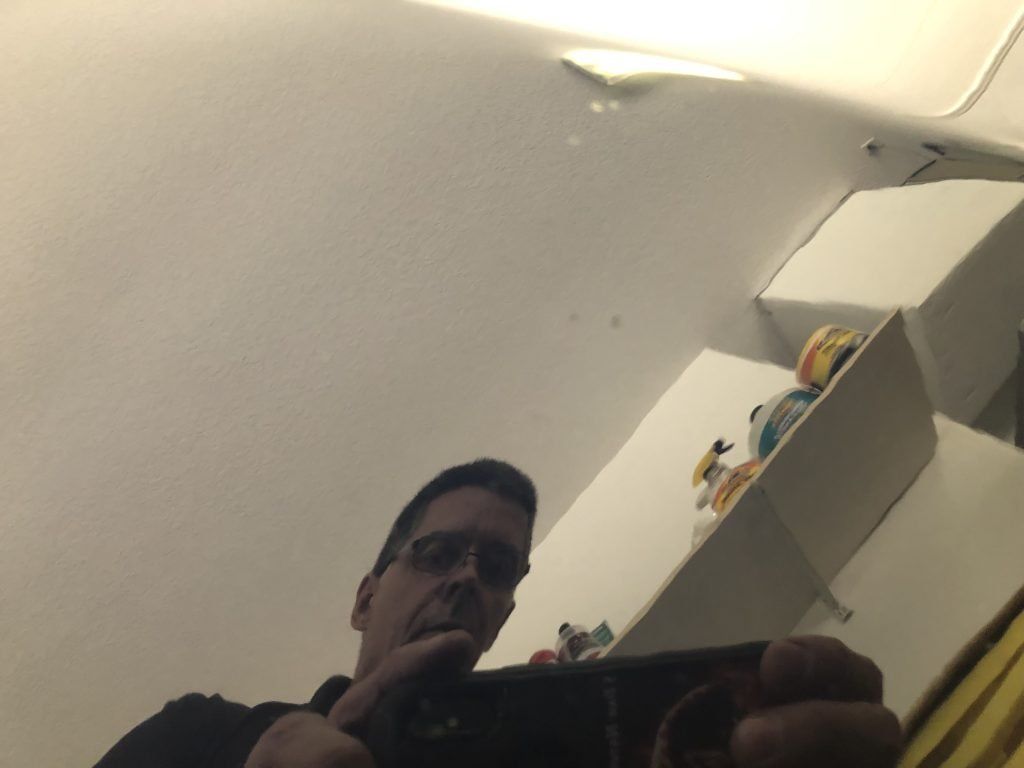 A man taking a picture of himself in a mirror