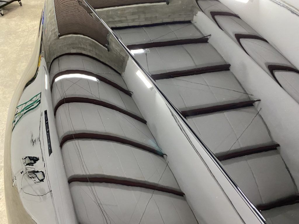 A close up of an escalator going up a building