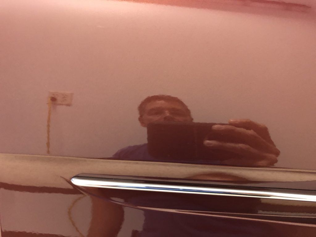 A man is taking a picture of himself in a mirror