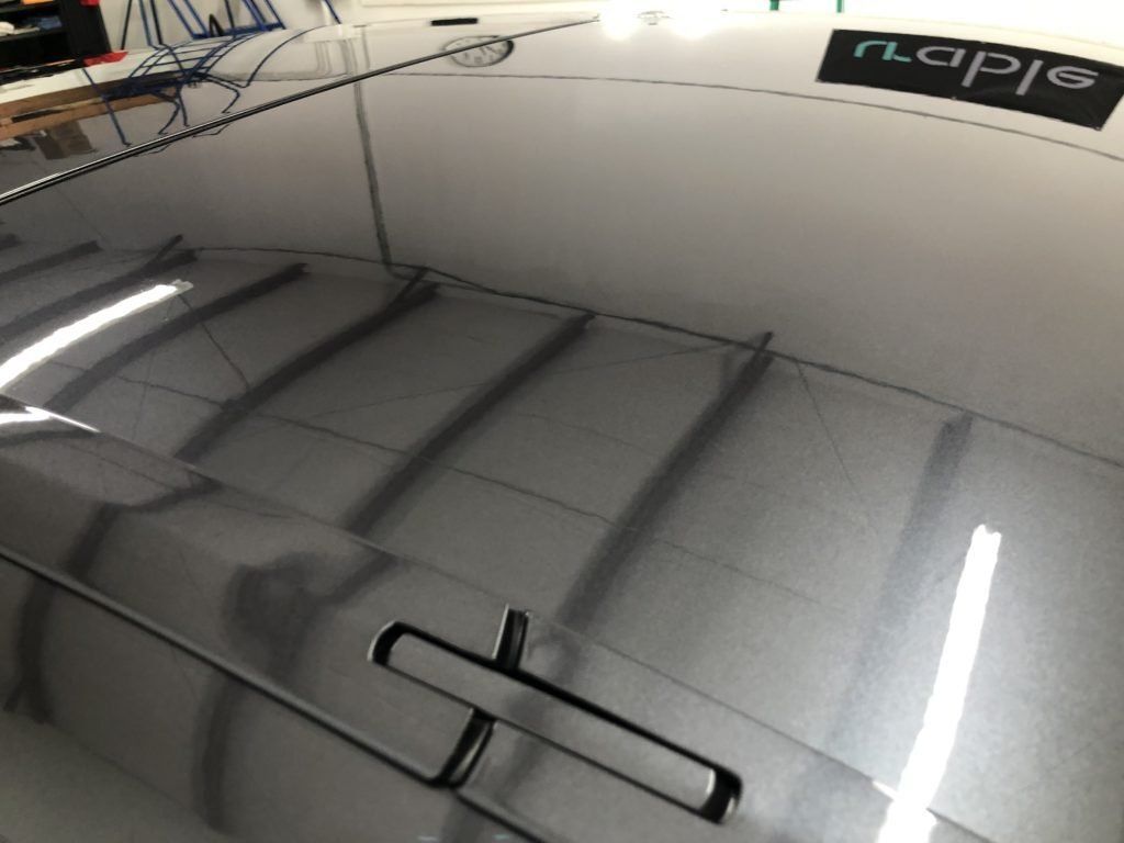 A close up of a car 's roof with a napje logo on it