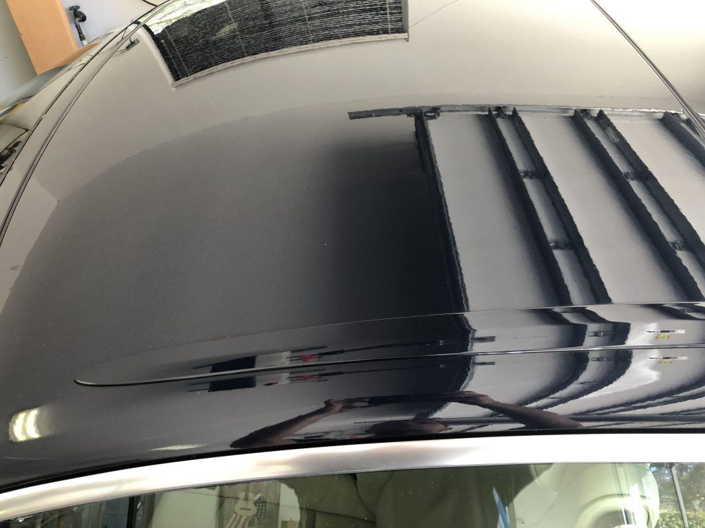 A close up of the roof of a black car