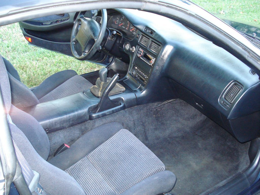 The interior of a car with the door open