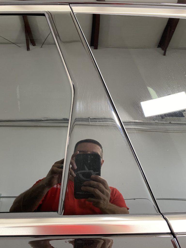 A man is taking a picture of himself in a mirror.