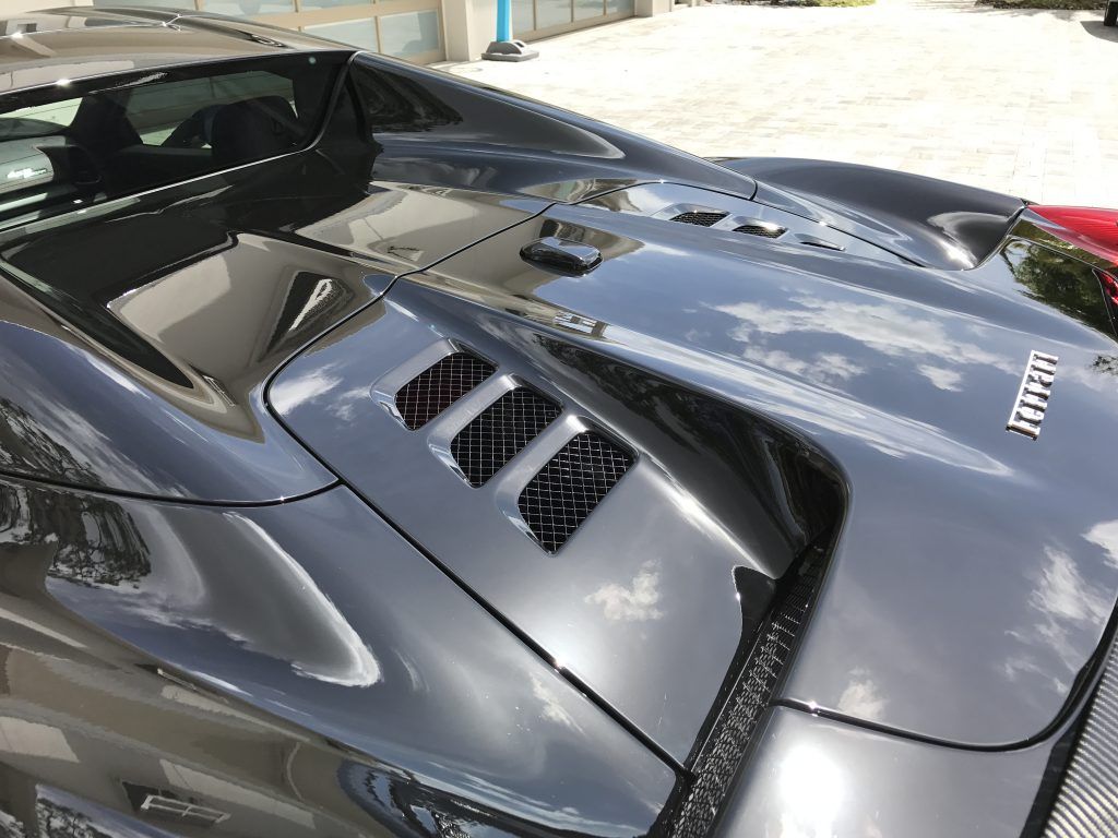 A close up of the hood of a ferrari sports car