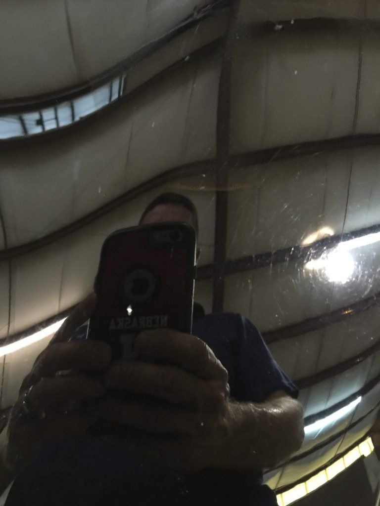 A man is taking a picture of himself in a mirror