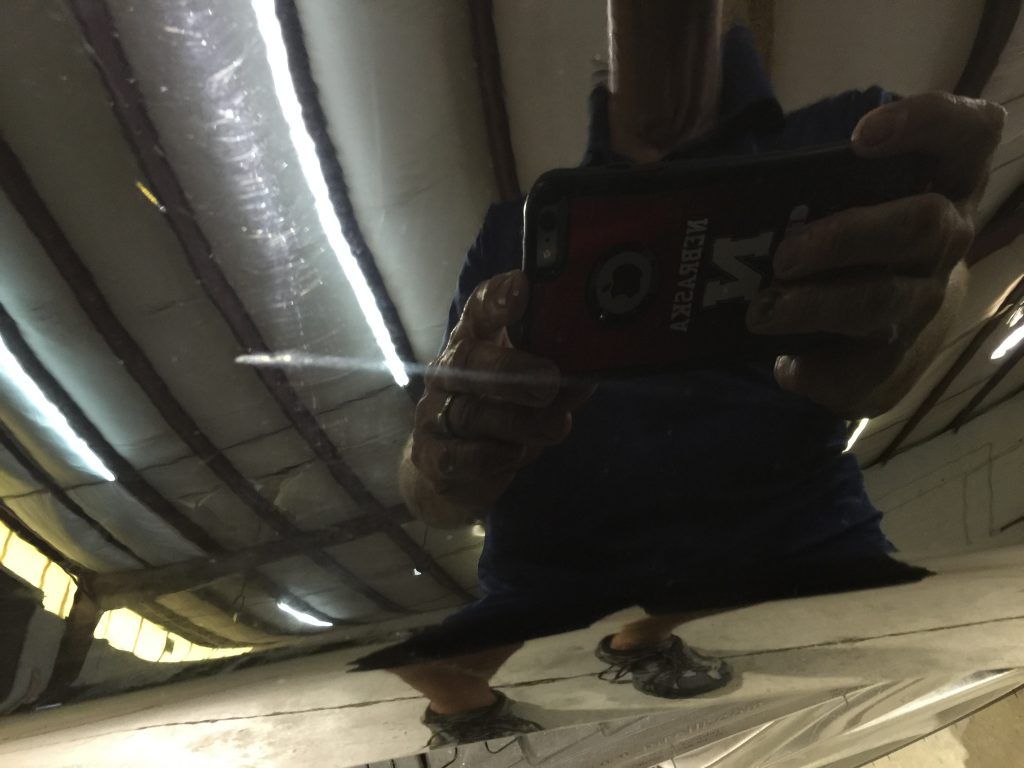 A person is taking a picture of themselves in a mirror with a phone that says yk on it