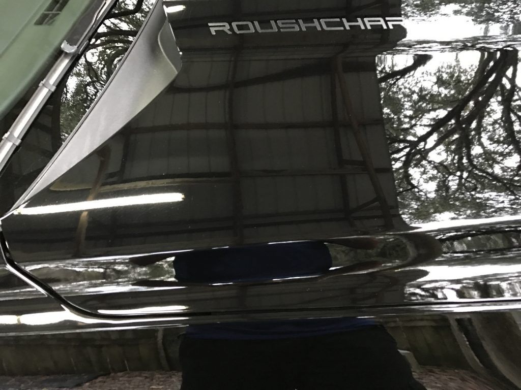 A close up of a roush car with the door open