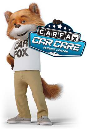 The Carfax mascot stands wearing a shirt and pants, holding a blue sign that reads "Carfax Car Care Service Center."