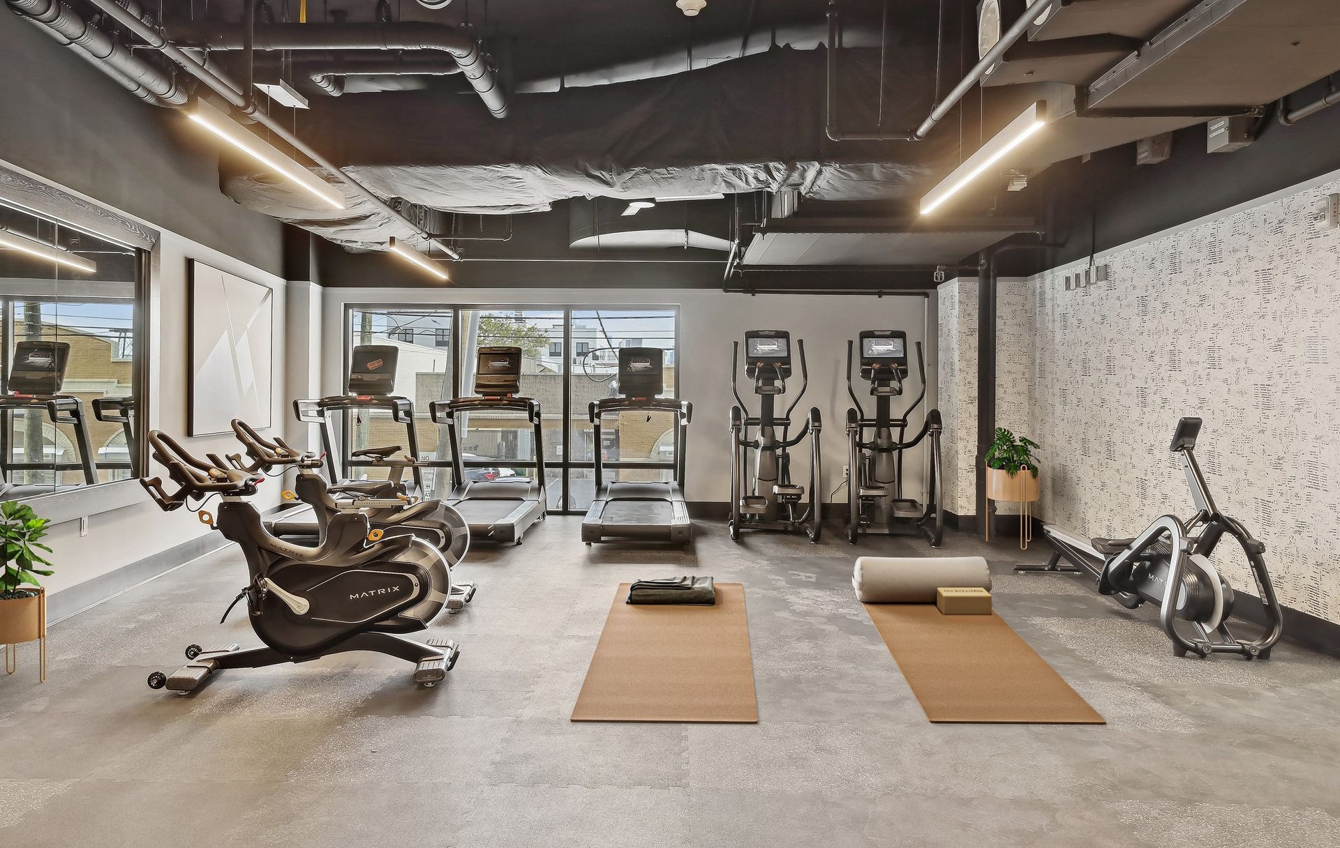 413 Summit gym with a matrix bike in the middle