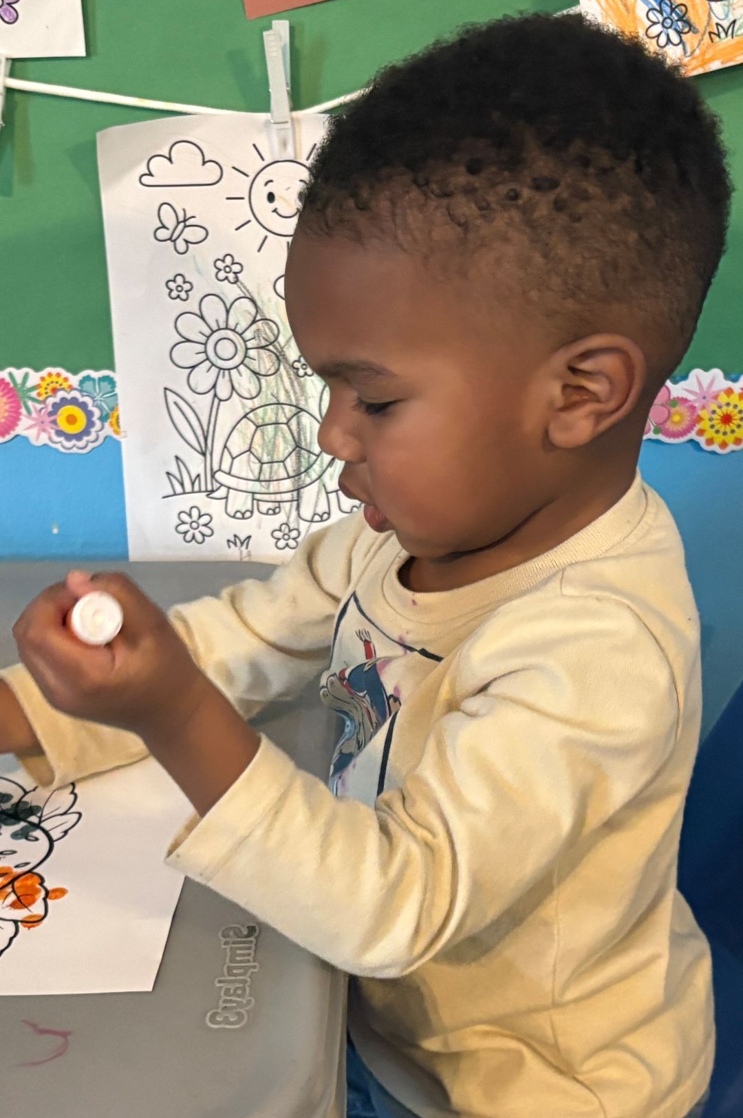 A woman and a child are playing with blocks.
