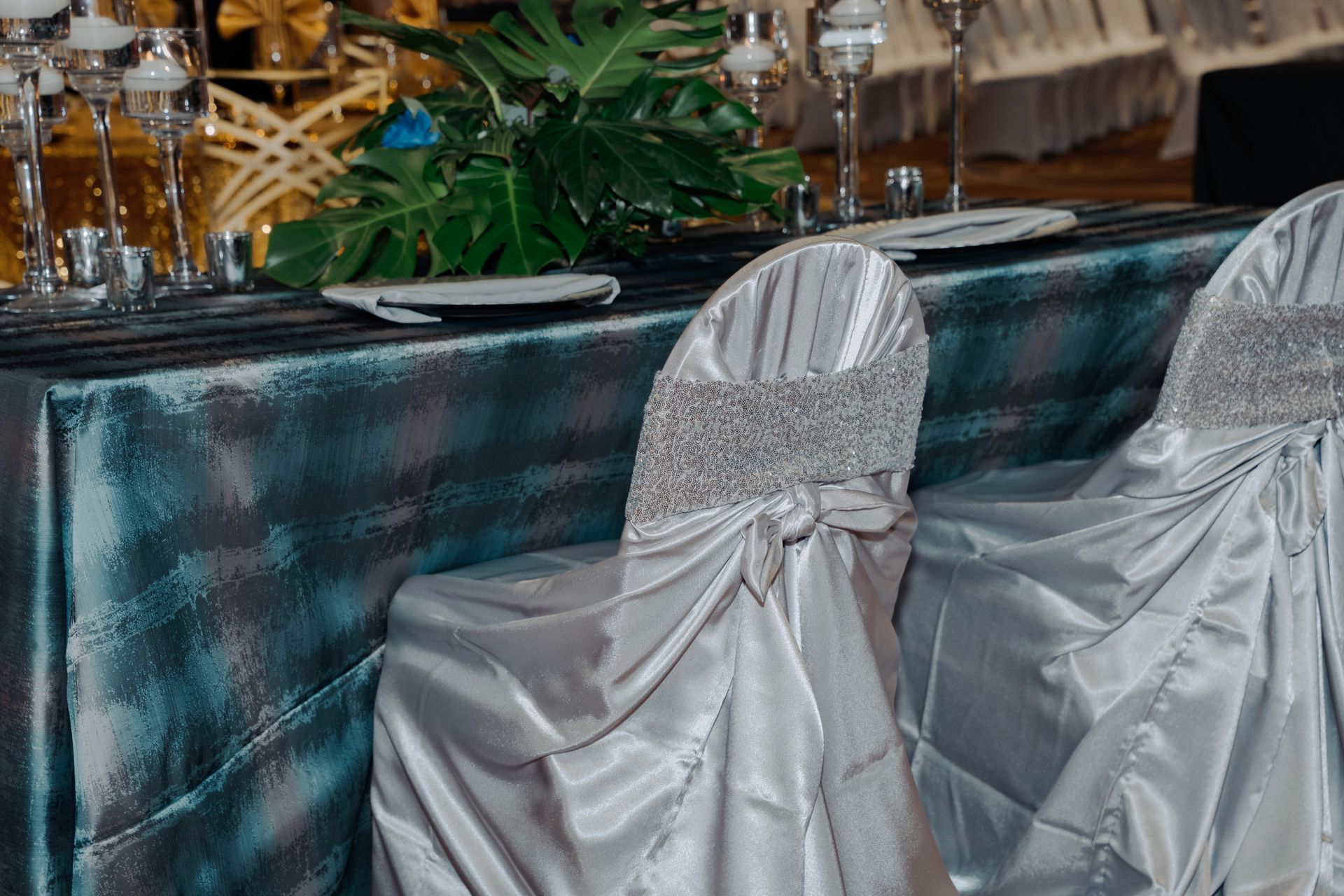 A table and chairs are set for a wedding reception.