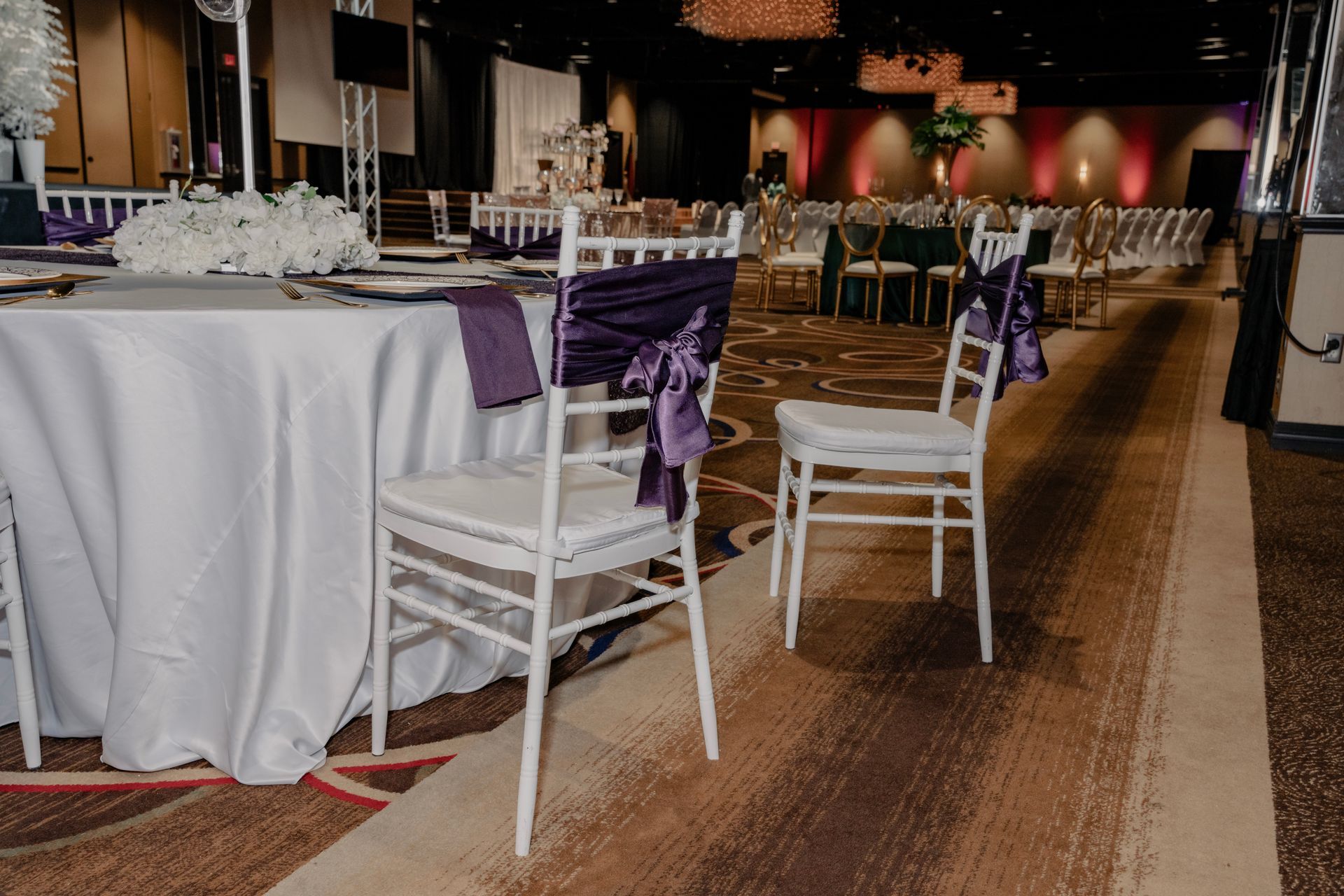 A table and chairs are set up for a wedding reception.