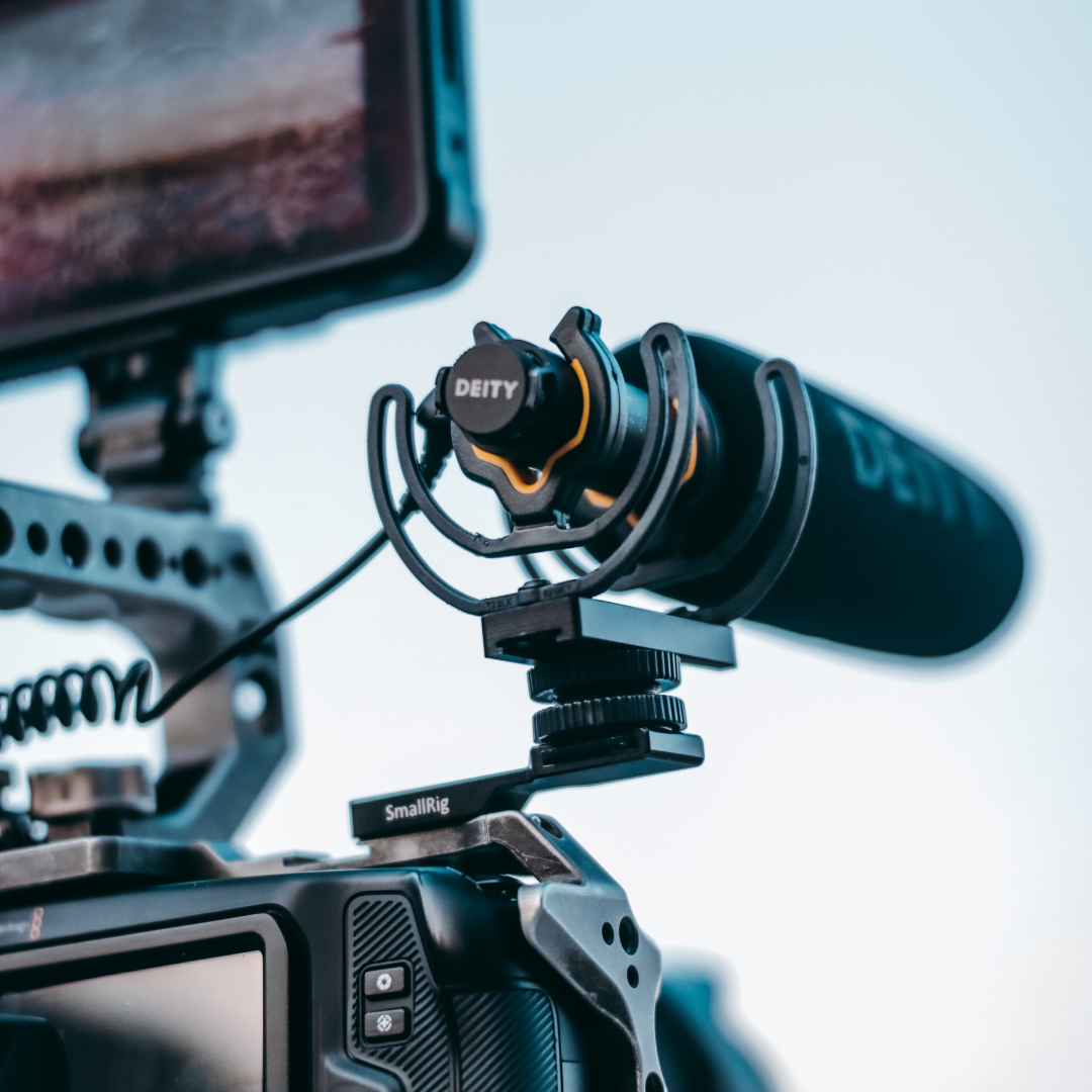 A dslr camera with a microphone attached to it